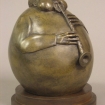 Side view of Saxophone Buddha, a bronze sculpture by John Leon